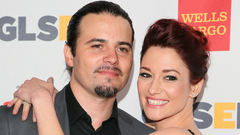 Chyler Leigh smiling with her arms around Nathan West