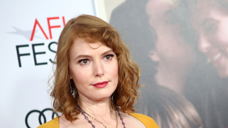 Alicia Witt in a yellow dress