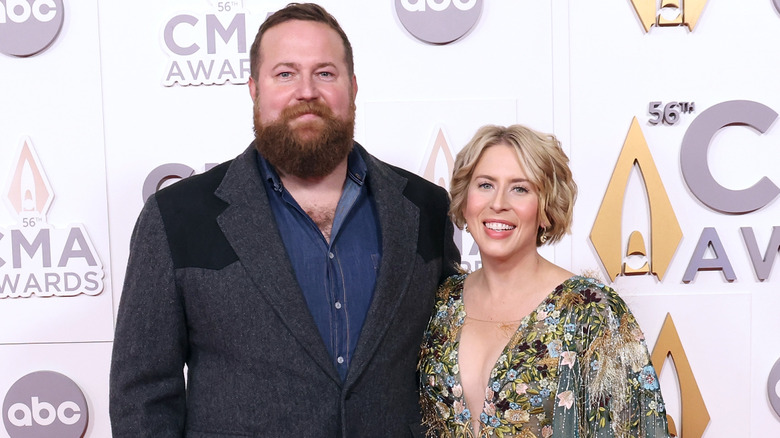 Ben Napier and Erin Napier smiling while posing at an event together