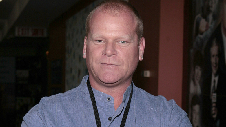 Mike Holmes smirking at the camera