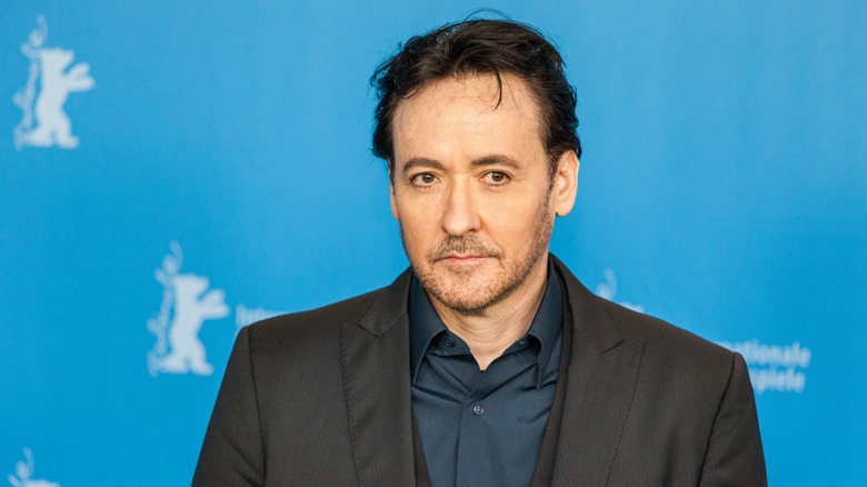 John Cusack posing for a photo in 2016.