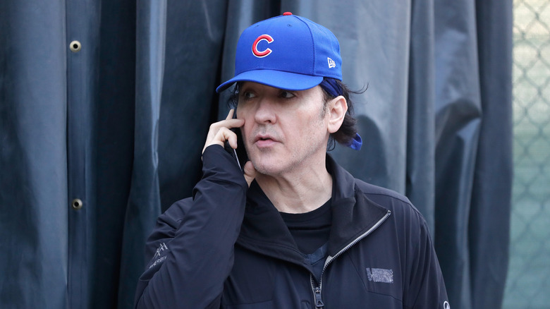 John Cusack talking on the phone at the 2016 World Series.