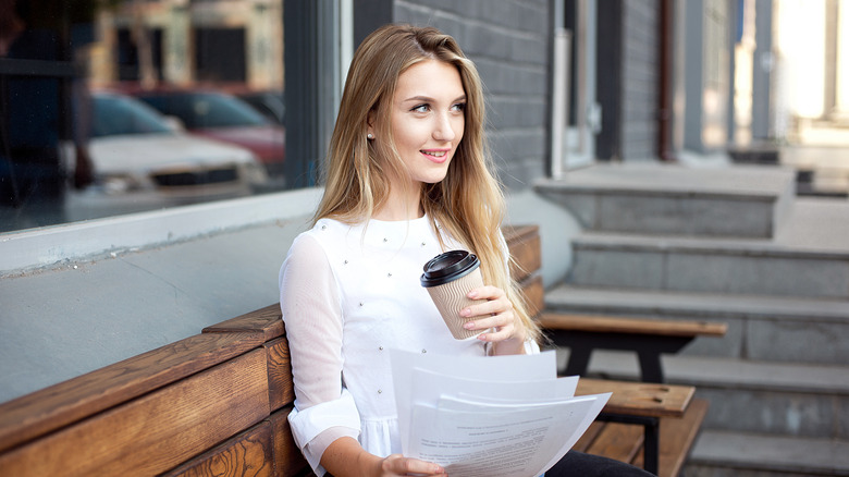 woman reading papers