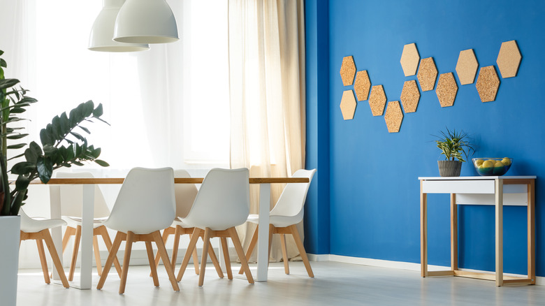 dining area with blue accent wall