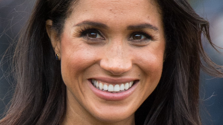 Meghan Markle smiles for photographers 