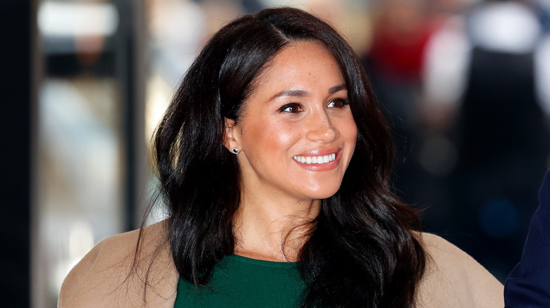 Meghan Markle smiles for photographers 