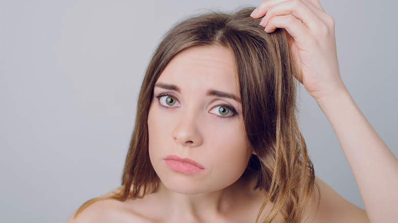 girl touching hair