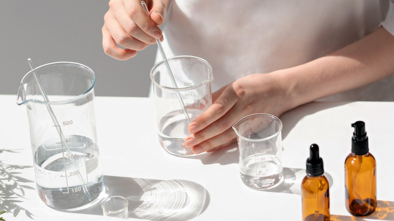 A chemist mixing liquids