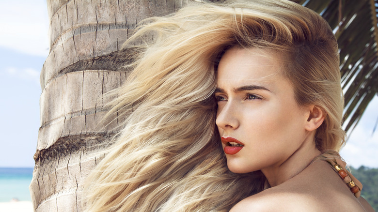 Woman with great hair on the beach