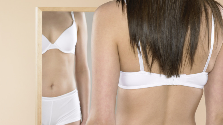 woman's body in mirror