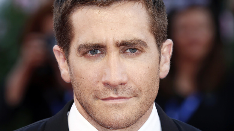 Jake Gyllenhaal posing in a suit