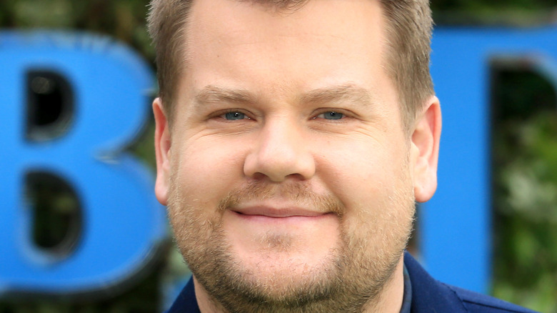 James Corden smiles with a blonde beard.