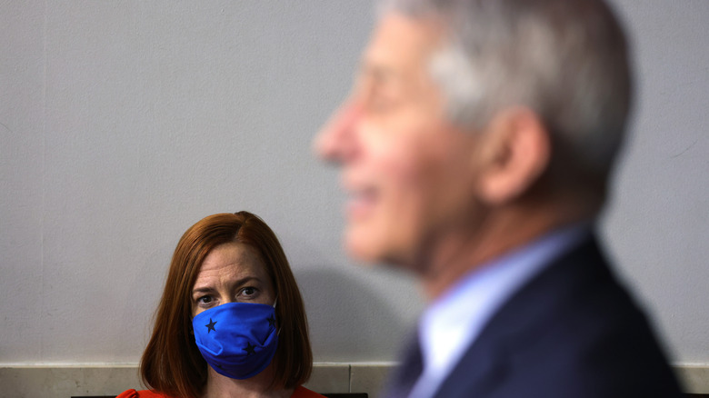 Dr Fauci speaking with Jen Psaki in the background