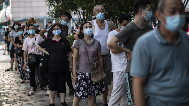 Residents in Wuhan lining up to get tested