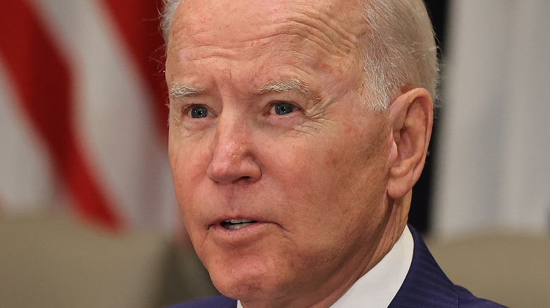 Joe Biden on July 12 at a meeting, wearing a blue suit