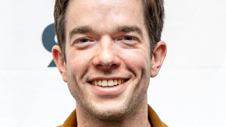 John Mulaney poses on the red carpet