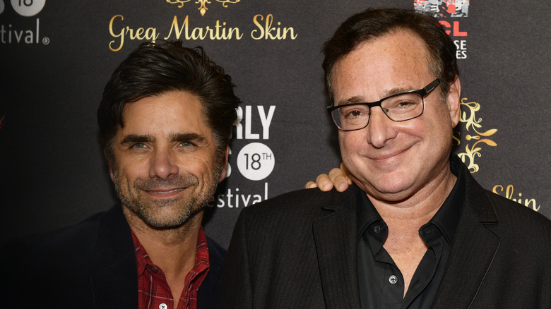 John Stamos and Bob Saget smiling