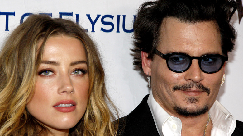 Johnny Depp and Amber Heard posing