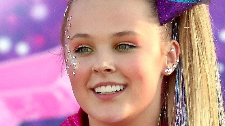 JoJo Siwa smiling on stage 