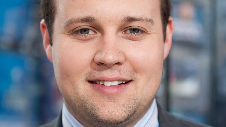 Josh Duggar smiling at an event 2014