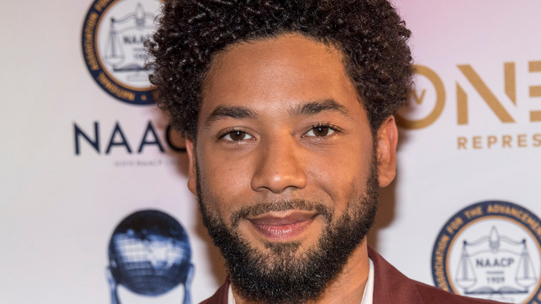 Jussie Smollett smiling on red carpet