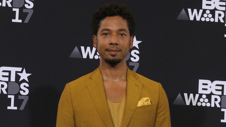 Jussie Smollett smiling on red carpet