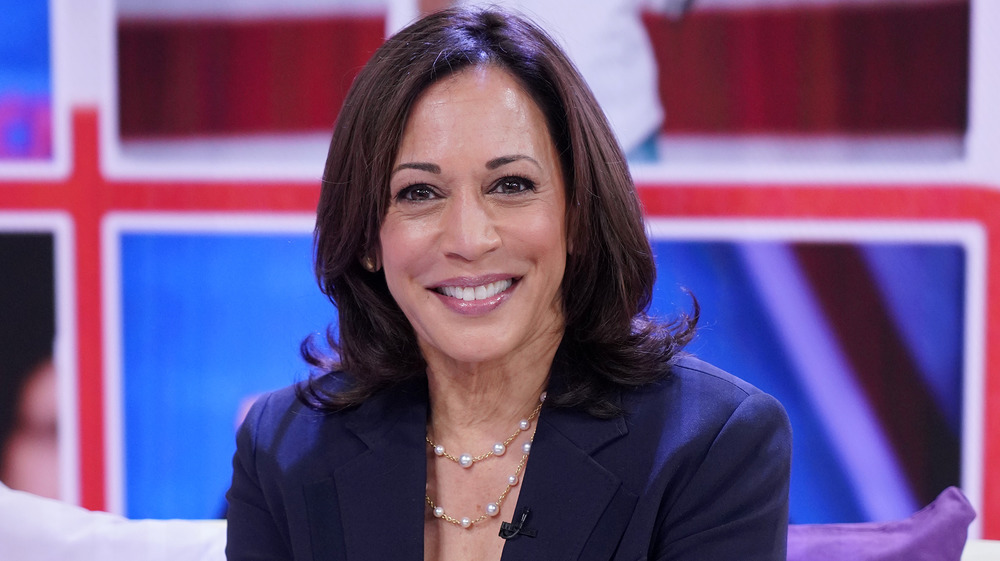 Kamala Harris smiling in suit