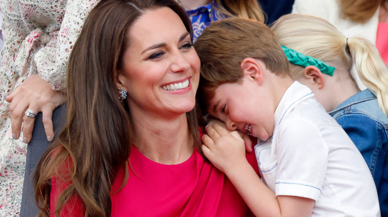 Kate Middleton holds Prince Louis