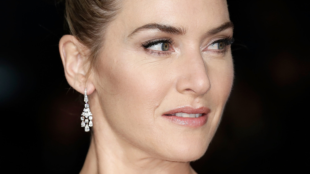 Kate Winslet glaring out of the corner of her eyes 