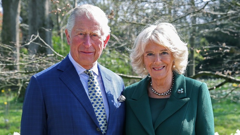 King Charles and Queen Camilla pose for a photo. 