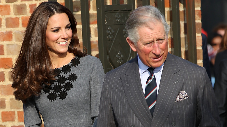 Kate Middleton smiling with King Charles
