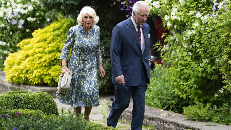 Queen Camilla and King Charles III leaving Llwynywermod
