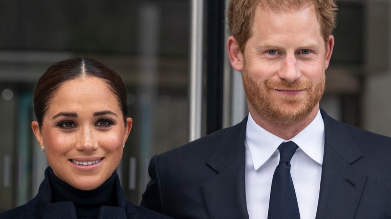 Prince Harry and Meghan Markle smiling