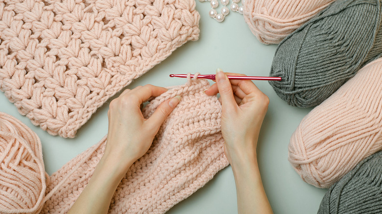 Female hand crochets