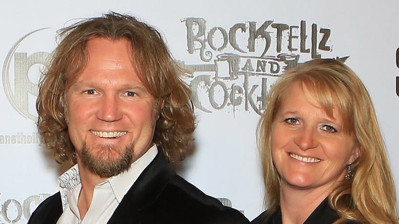 Kody Brown and Christine Brown smiling on red carpet