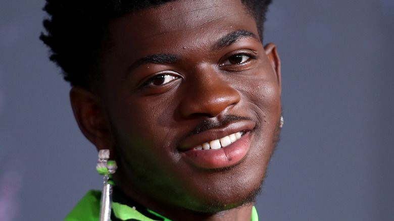Lil Nas X smiling at an event