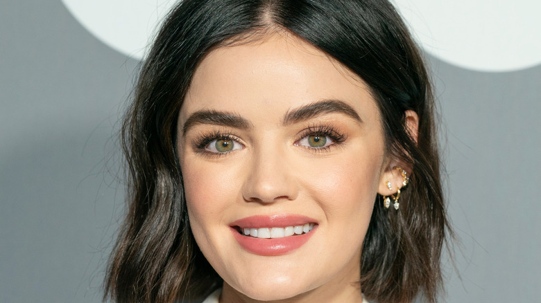 Lucy Hale smiling at GQ event with short hair