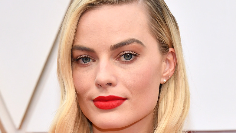 Margot Robbie poses on the red carpet