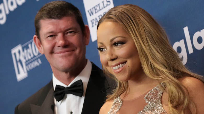 James Packer stands behind Mariah Carey