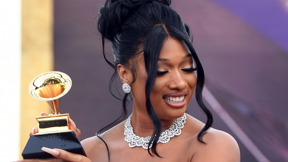 Megan Thee Stallion holding Grammy