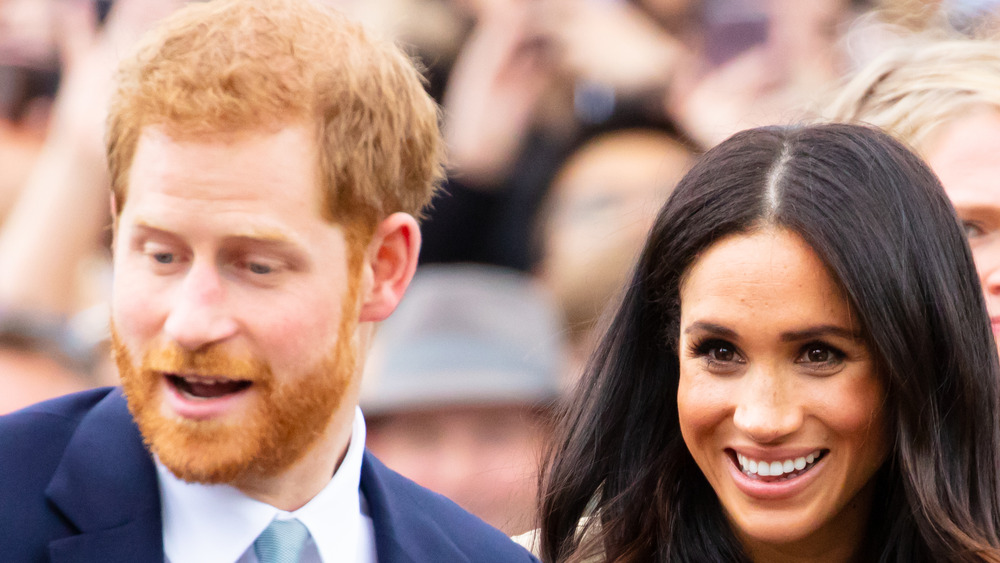 Prince Harry and Meghan Markle smiling