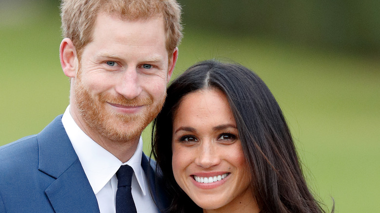 Meghan and Harry smiling