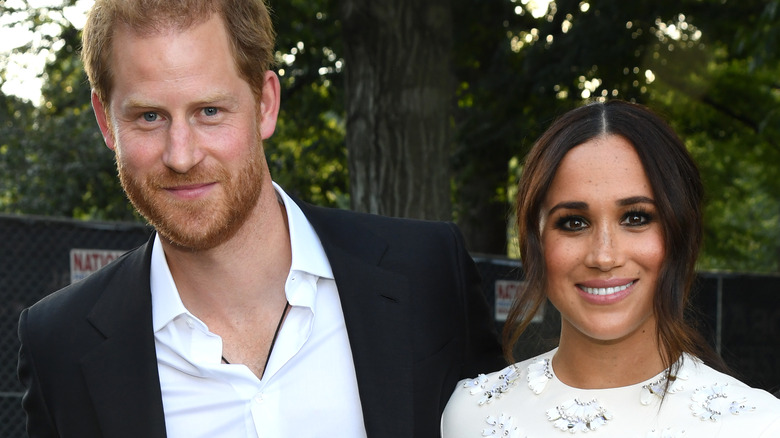 Prince Harry and Meghan Markle smiling