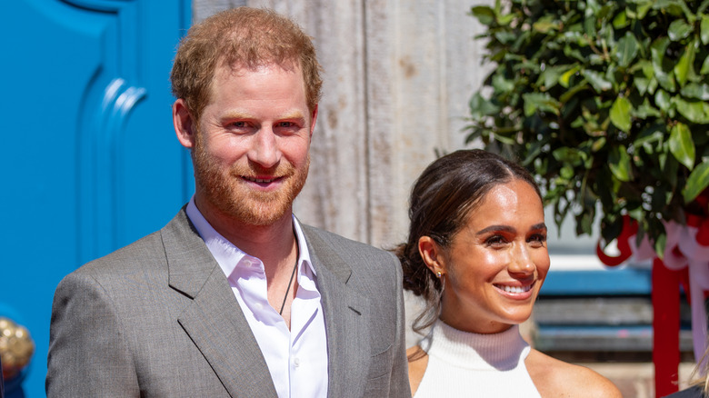 Prince Harry and Meghan Markle smiling