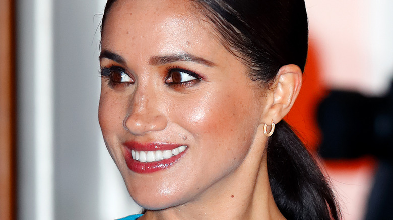 Meghan Markle smiles at an event.