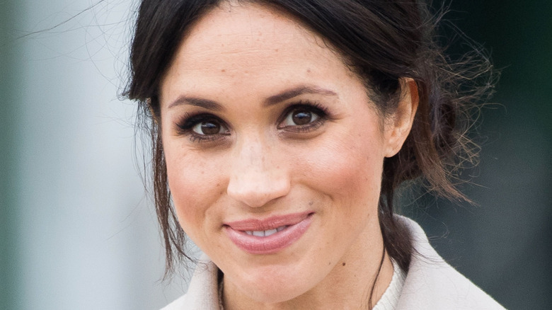 Meghan Markle smiling at camera