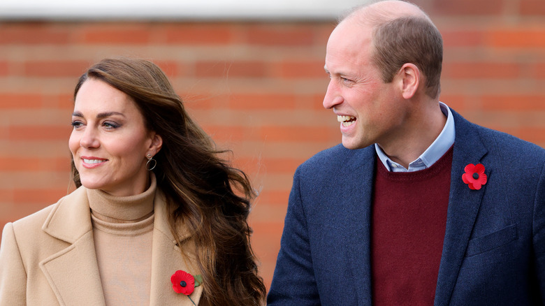 William, Prince of Wales and Catherine, Princess of Wale wearing poppies