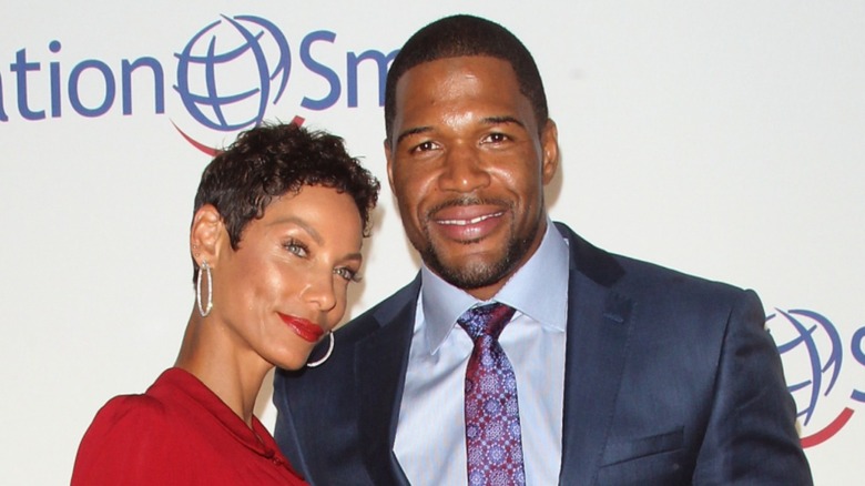 Nicole Murphy and Michael Strahan posing together