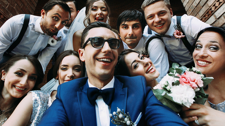 Wedding party taking selfie