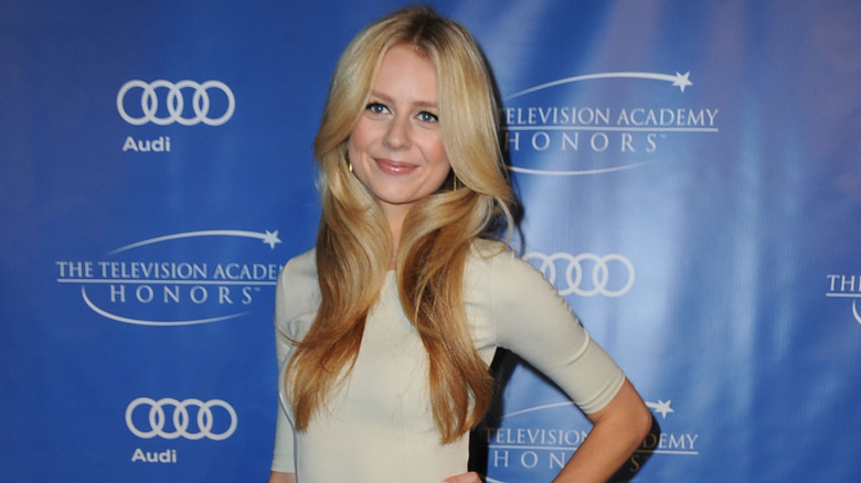 Justine Lupe posing on step-and-repeat